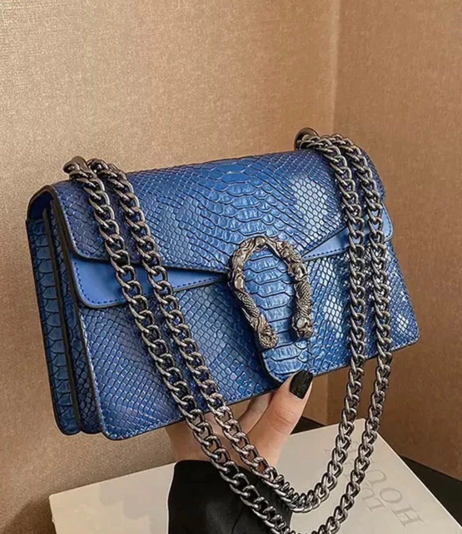 4. The Serpentine Luxe Handbag